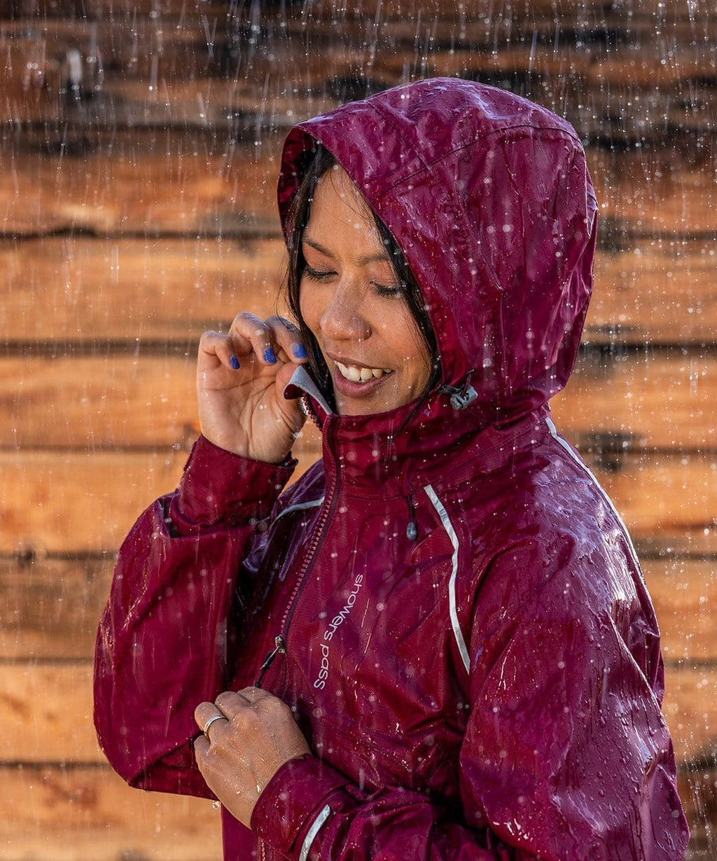 Women's Syncline CC Jacket, red, hood up in the rain
