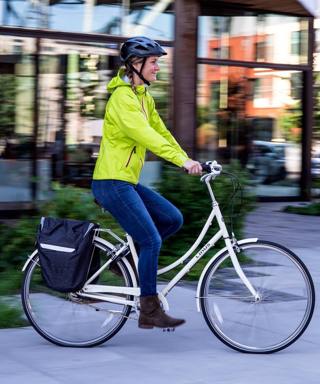 Women's Syncline CC Jacket, hi-vis yellow, worn riding a city bike