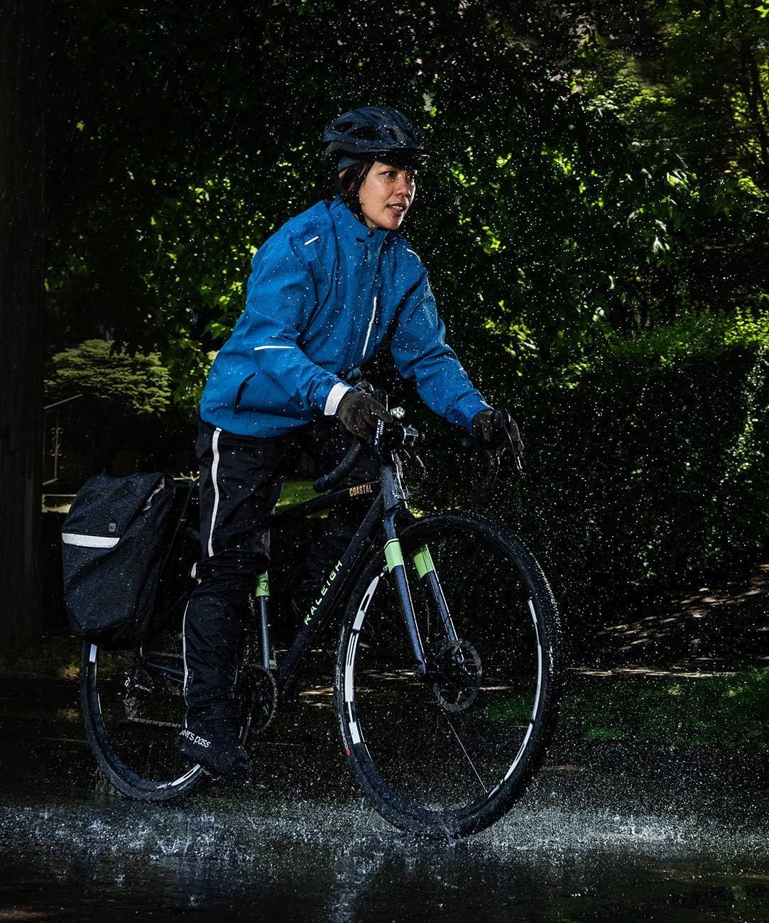 Women's Transit Pant, worn riding in the rain with a blue jacket