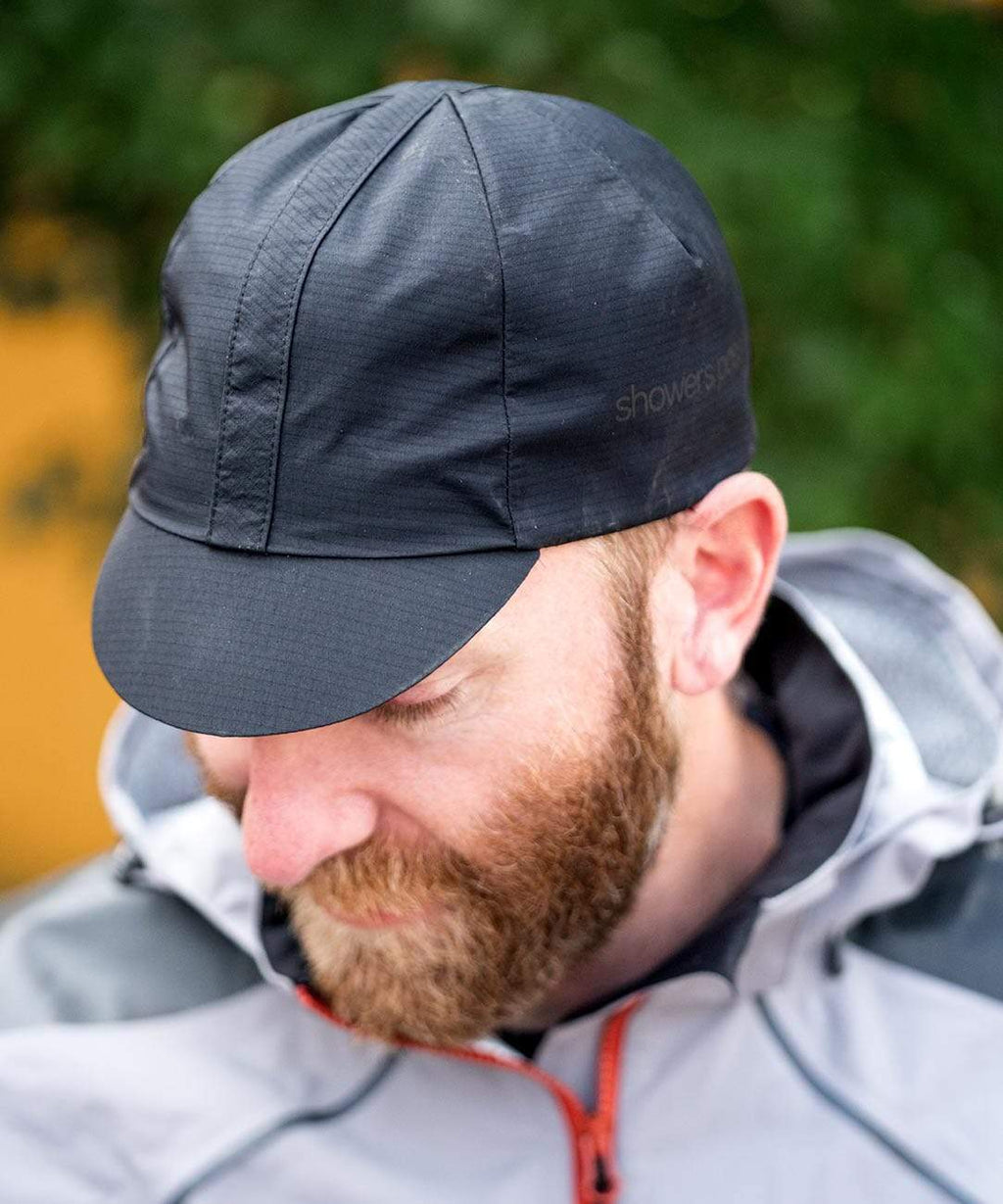 Elite Cycling Cap, black, worn by a rider looking down