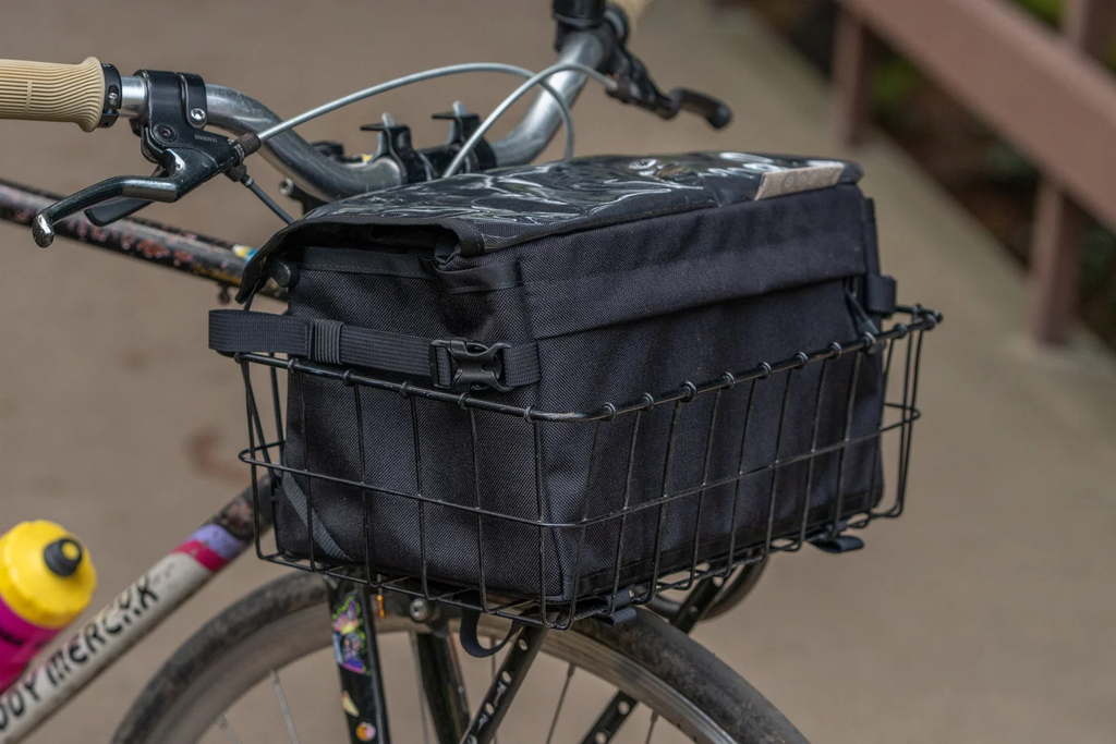 Outer Shell 137 basket bag in black, fitted inside a front wire basket