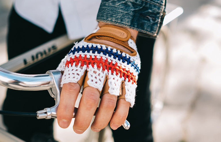 Leather Bike Gloves, striped crochet pair worn on a handlebar