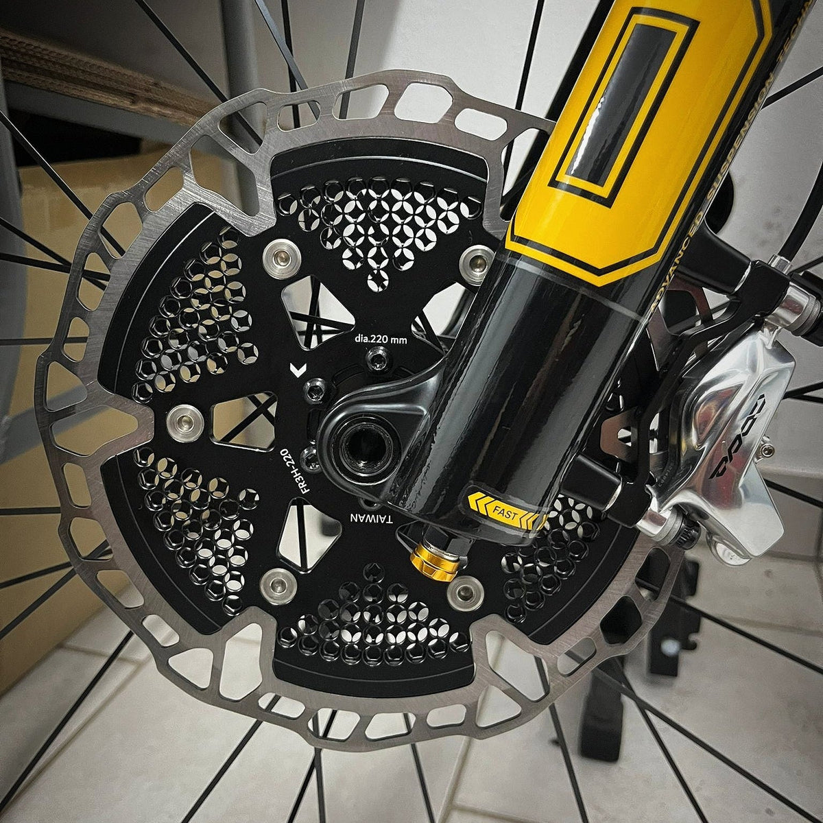 Sumart FR3H Floating Disc Brake Rotor, on the front wheel of a mountain bike next to the caliper
