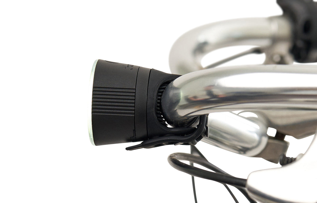 Traveler 2.0 Magnetic Bike Lights, black front light mounted on a handlebar