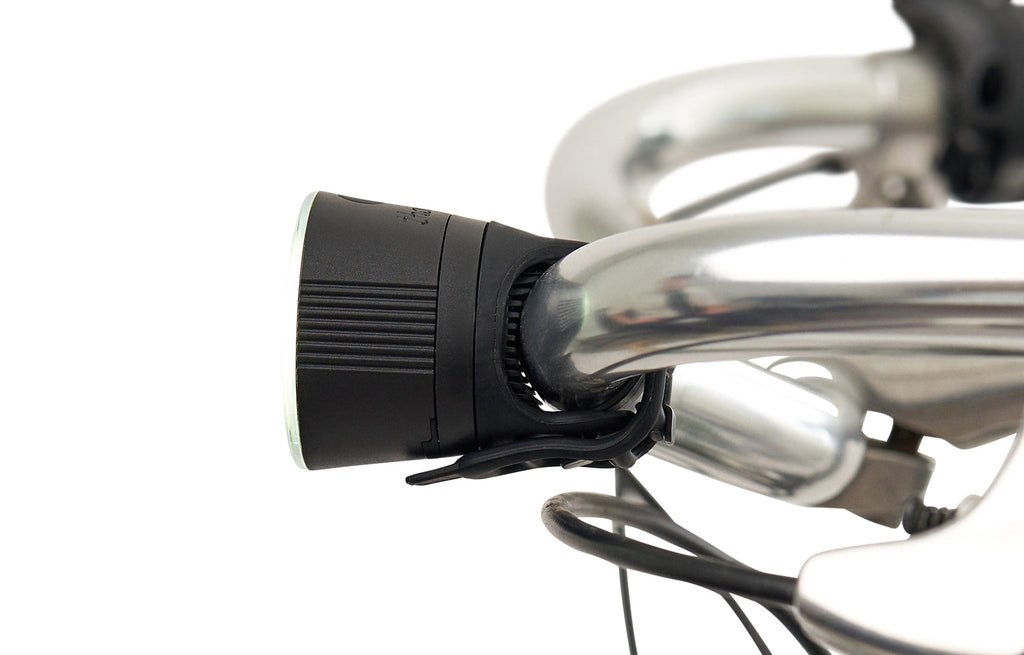 Traveler 2.0 Magnetic Bike Lights, black front light mounted on a handlebar
